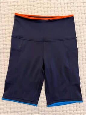 Cotopaxi Navy Bike Shorts with Orange Waistband & Blue Hem